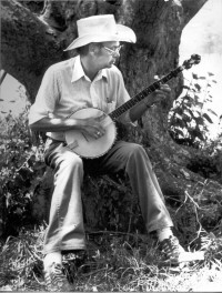 Prof. Deetz playing banjo at Flowerdew Hundred site, 1981